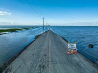 A drone view of floodwaters from the March storms have cut across 6th Avenue south of Corcoran, in Kings County, California. The floodwaters are reforming Tulare Lake, once the largest freshwater lake west of the Mississippi River, Tulare Lake was largely drained in the late 19th and early 20th centuries.