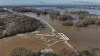 Rain swells the Sacramento River and overtops the Fremont Weir. Photo taken Dec. 29, 2025