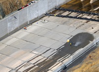 A drone view of workers performing maintenance on the spillway of the Oroville Dam located at Lake Oroville in Butte County, California. Photo taken October 2, 2023.